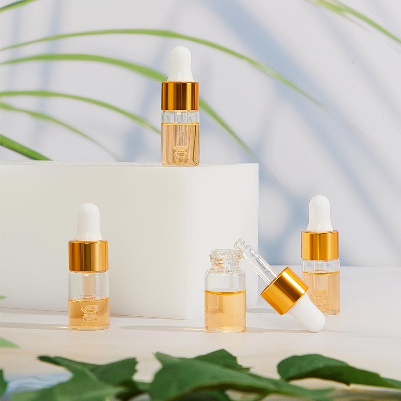 Didaey Mini Glass Oil Dropper Bottle Bulk, Clear Essential Small Empty Bottles Sample Containers Perfume Liquid Vials with Cap for Traveling(3 ml,Gold,200 Pcs)