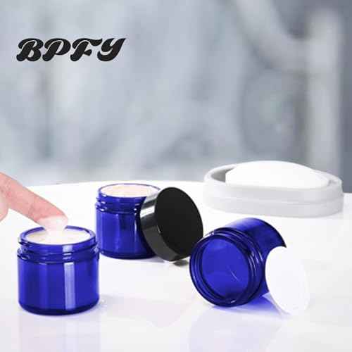 24 Pack 2 oz Round Blue Glass Cosmetic Jars with Inner Liners and Black Lids, Travel Jars, Refillable Containers for Makeup, Cream, Lotion, Sugar Scrubs, Eye Shadow, Slime, Paint, Jewelry