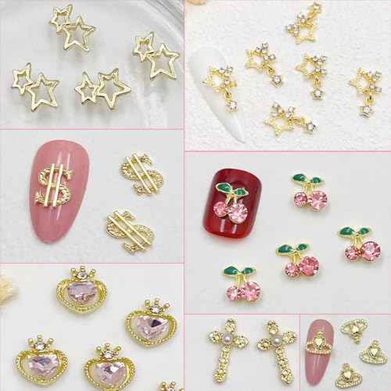 106 PCS Gold Nail Charms 3D Nail Art Charms Cherry Butterfly Cross Bow Star Heart Dollar 3D Nail Gems for Women Nail Art DIY Design