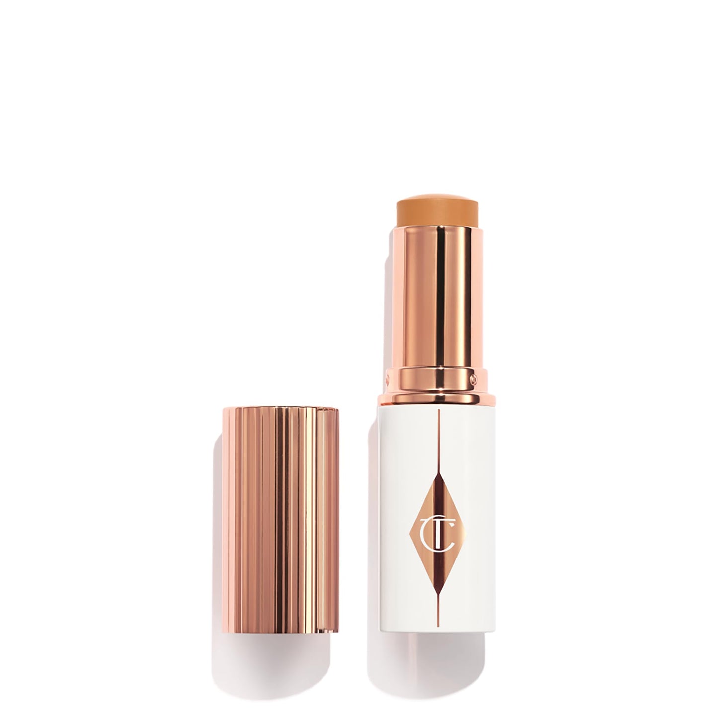 Charlotte Tilbury Unreal Skin Tint & Sheer Glow Hydrating Foundation Stick - Cream Foundation Makeup with Sheer-to-Light Coverage & a Buildable Formula - Blurring, Smoothing & Nourishing - 10 Tan