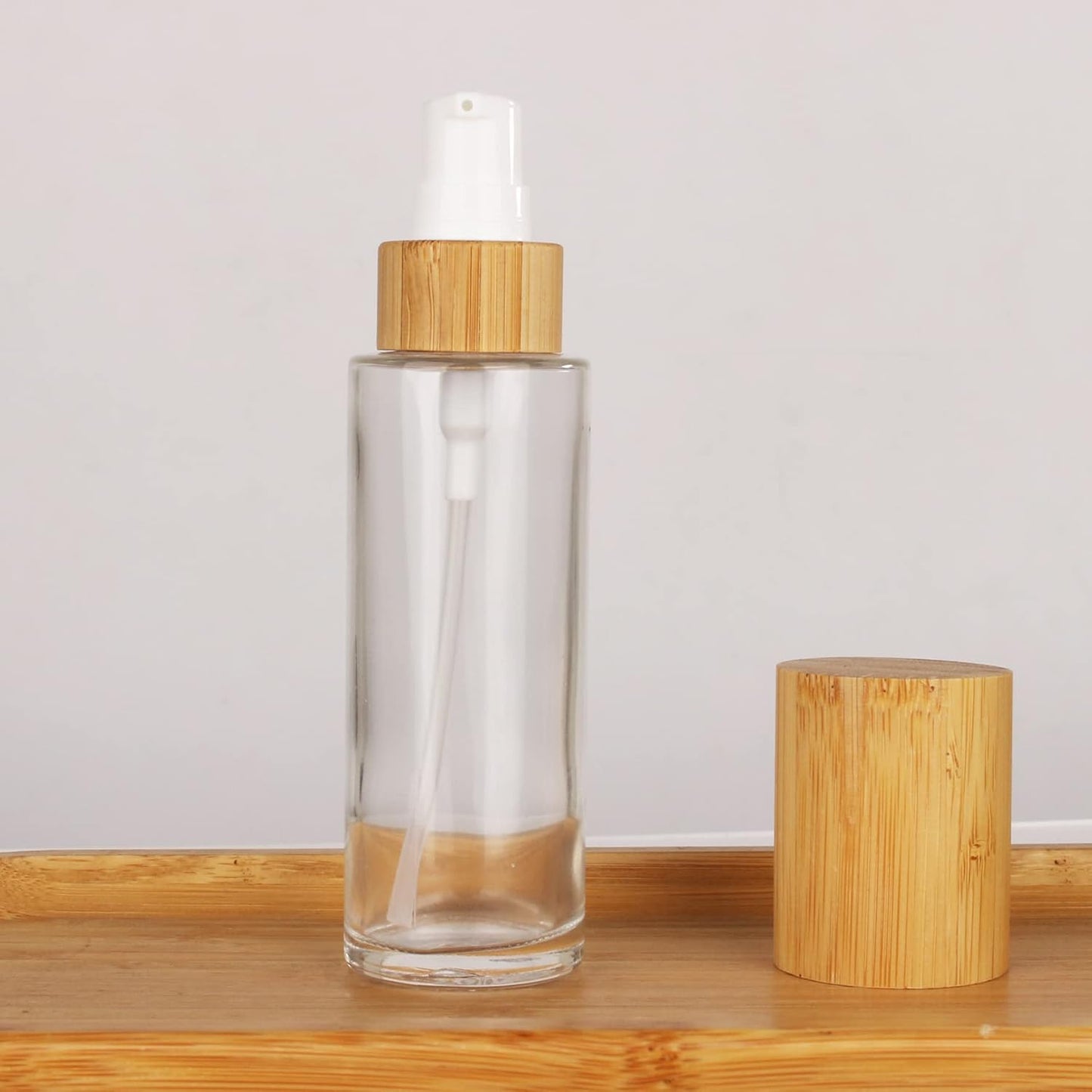 COSIDEA 6-Pack 2oz Clear Glass Bottles with Bamboo Lids - Refillable Lotion Pump Dispenser for Travel Toiletries