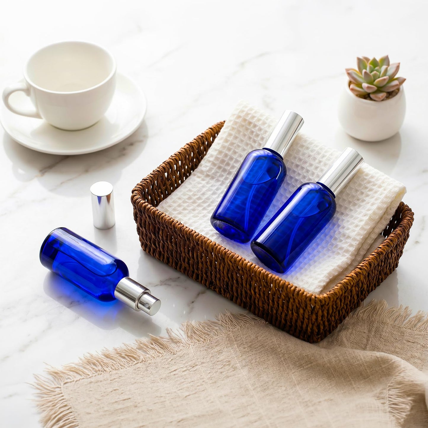 Foraineam 9 Pack 100ml / 3.4 oz. Blue Glass Spray Bottles with Atomizer Refillable Fine Mist Spray Bottle Containers for Perfume, Essential Oils, Cleaning Products
